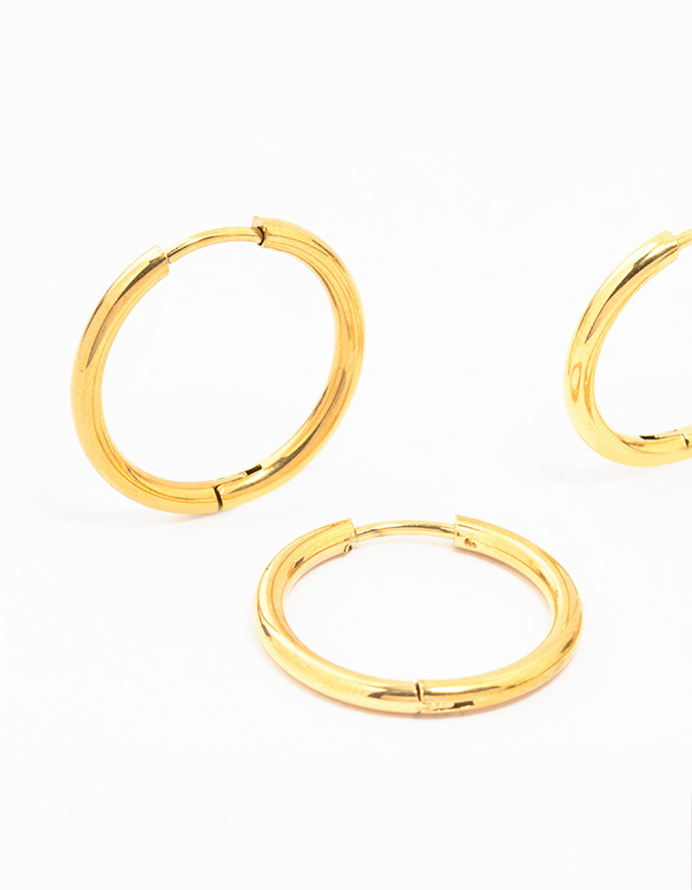 Featuring waterproof mini hoop earrings crafted from gold plated stainless steel in a 2-pack close up view