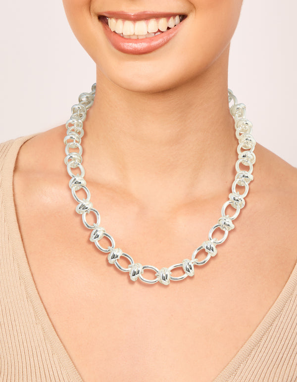 Featuring a silver plated knotted chain necklace on neck view