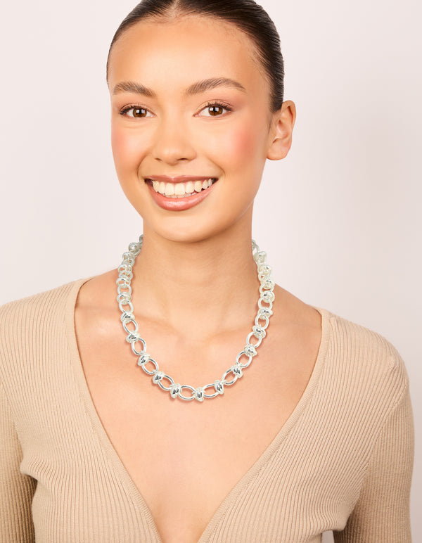 Crafted from silver plated material, this knotted chain necklace on model view