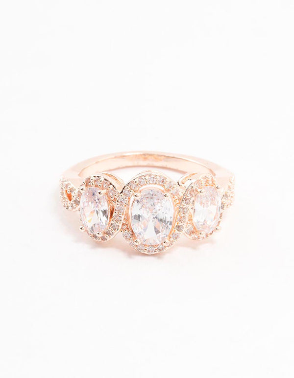 Crafted with rose gold plated metal and trio oval cubic zirconia stones close up view