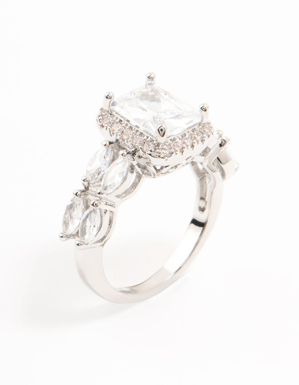 Showcasing a silver eloquent cubic zirconia rectangular ring featuring a center stone surrounded by pave detailing side detail view