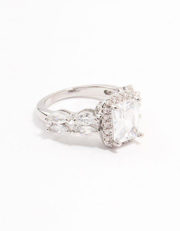 Beautifully crafted silver eloquent cubic zirconia rectangular ring with a halo setting and marquise accent stones front view
