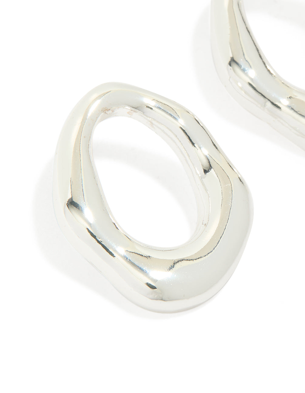 Highlighting molten open circle stud earrings in silver plated metal close up view
