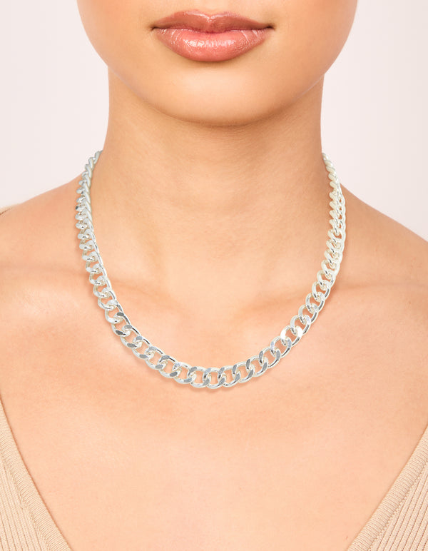 Crafted from silver plated material, this curb chain necklace sits elegantly on neck view