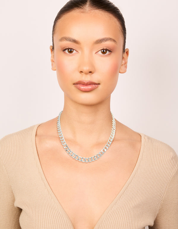 Featuring a silver plated curb chain necklace on model view