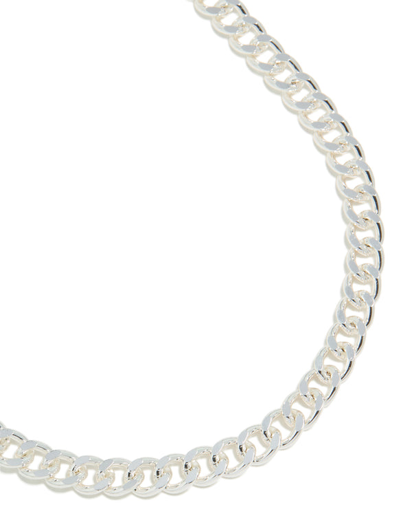 Showcasing a silver plated curb chain necklace close up view