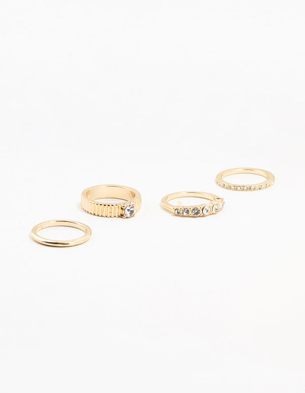 Discover this gold plated ribbed and diamante rings 4-pack in stackable style front view