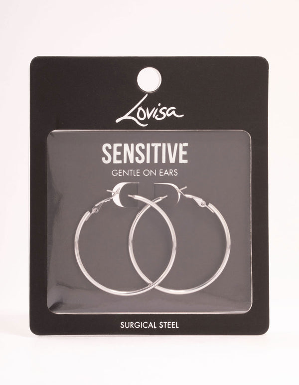 Displaying surgical steel thin hoop earrings in silver with hoop closure post detail view