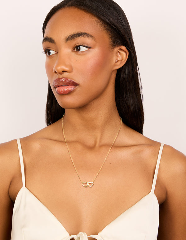 Beautifully designed gold plated sterling silver double heart cubic zirconia necklace on model view