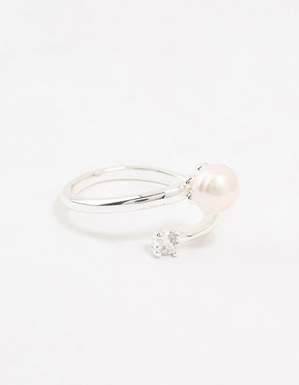 Beautifully crafted dainty silver plated ring wrapped with cubic zirconia and pearl accents close up view