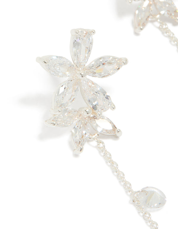 Stunning flower station drop earrings crafted from silver plated cubic zirconia featuring floral charm elements close up view