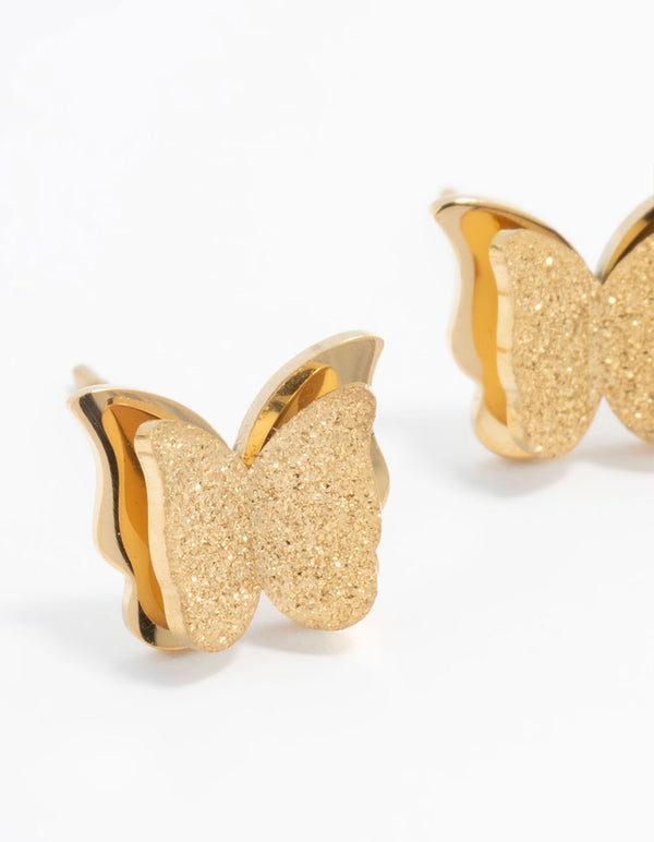 Waterproof gold plated stainless steel butterfly stud earrings featuring glitter close up view