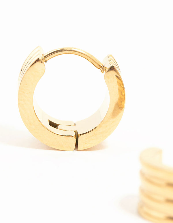 Designed with waterproof gold plated stainless steel ribbed huggie closure earrings close up view