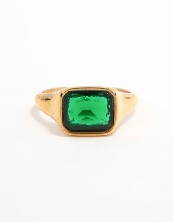 Crafted from waterproof gold plated stainless steel, this green cubic zirconia signet ring features crystal detailing close up view