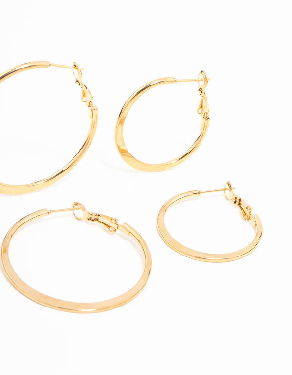 Three pairs of waterproof thin hoop earrings in gold plated stainless steel highlighting closure details in post detail view