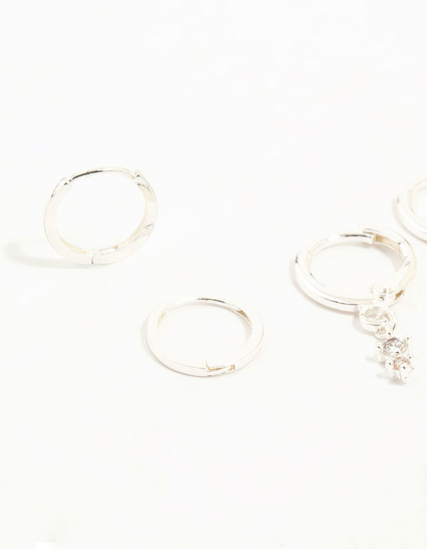Featuring dainty charm hoop earrings with cubic zirconia in a 3-pack close up view