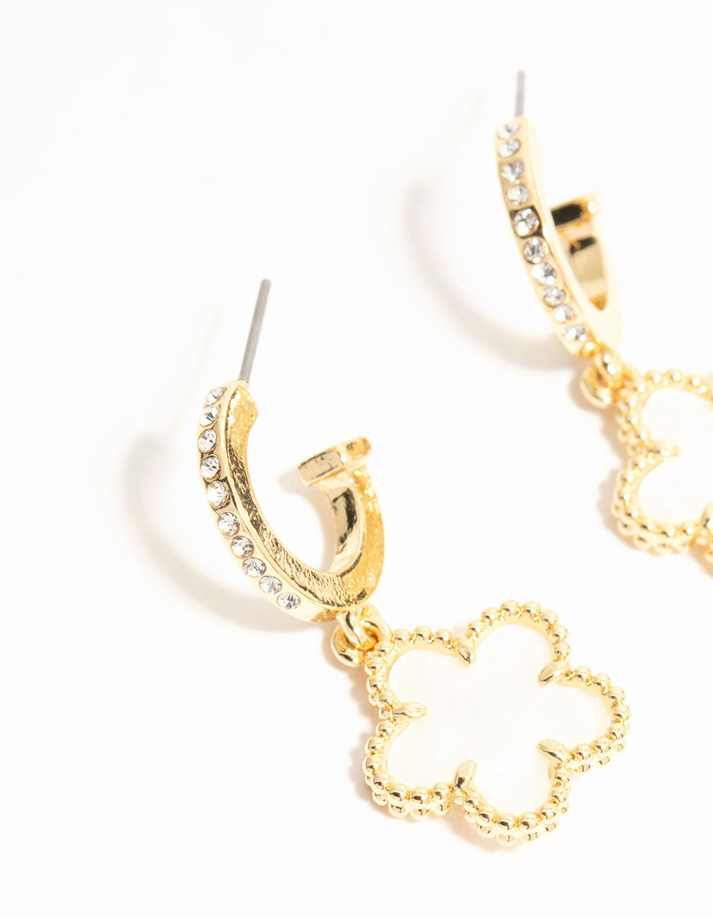 Detailed view of gold plated flower drop diamante hoop earrings in white close up view