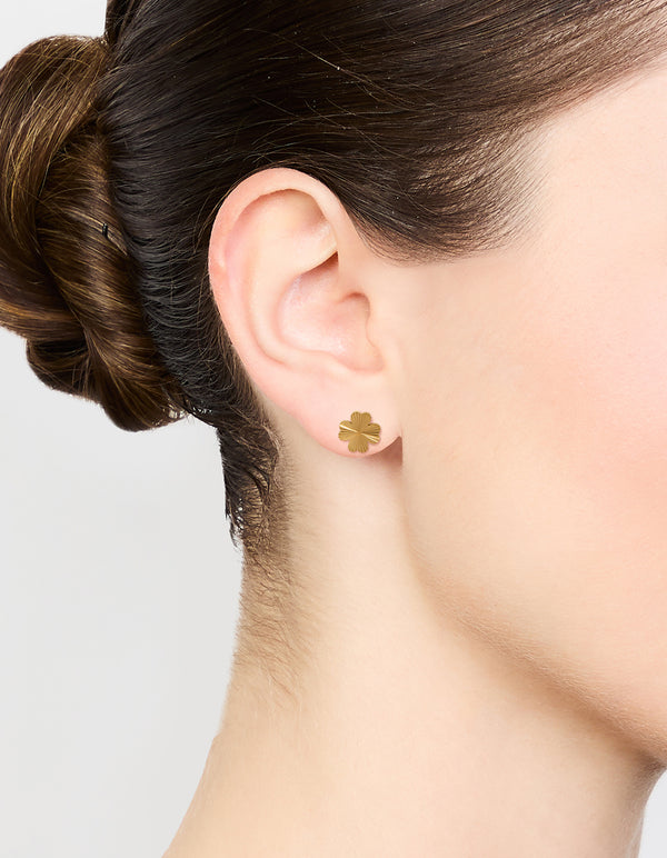 Showcasing waterproof gold plated stainless steel stud earrings with floral design in gold on ear view