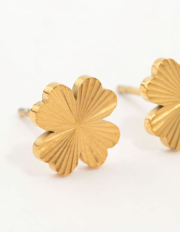 Detailed look at waterproof gold plated stainless steel stud earrings with floral design in gold close up view