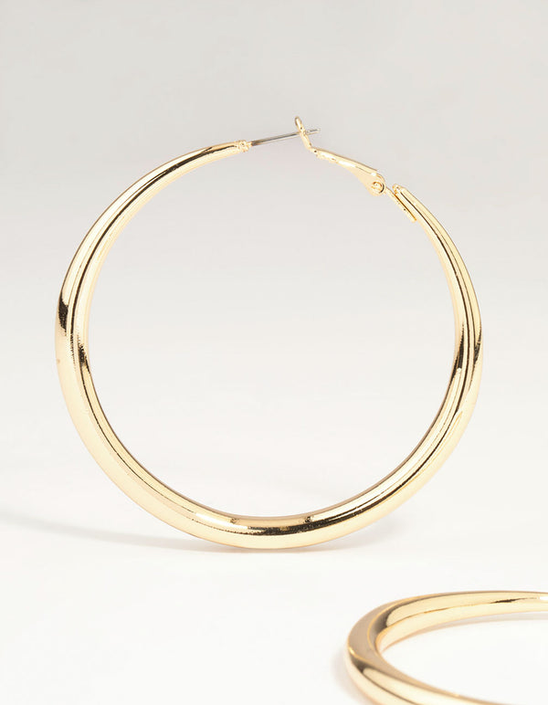 Designed with gold dome hoop earrings with closure showcasing post detail view