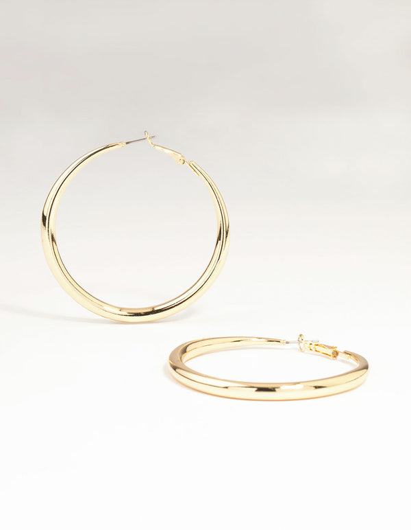 Showcasing gold dome hoop earrings with closure in a polished finish front view