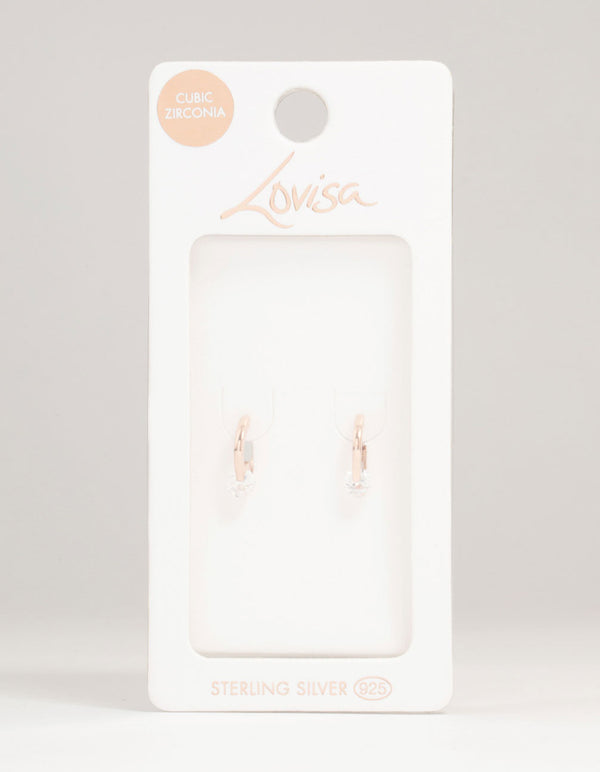 Showcasing rose gold plated sterling silver cubic zirconia huggie earrings with round stone cut front view