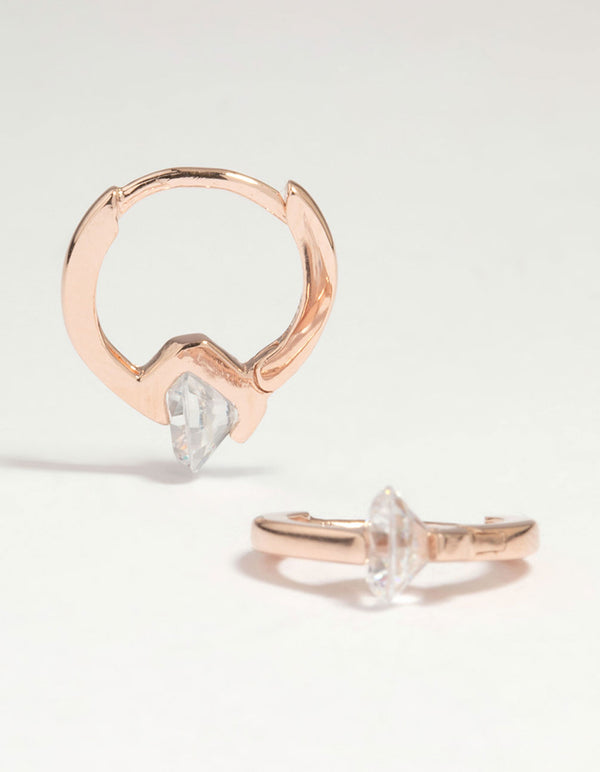 Showcasing rose gold plated sterling silver cubic zirconia huggie earrings with round stone cut front view