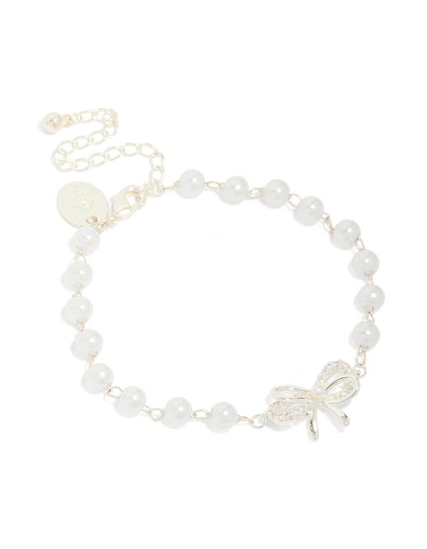 Showcasing a silver plated pearl double bow bracelet front view