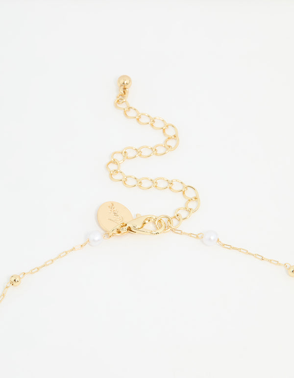 Gold Plated Pearl Station Cross Necklace