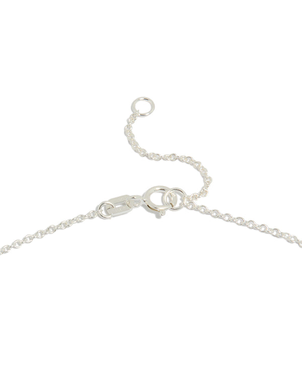 A sterling silver cubic zirconia micro flower pendant necklace with dainty clasp detail view