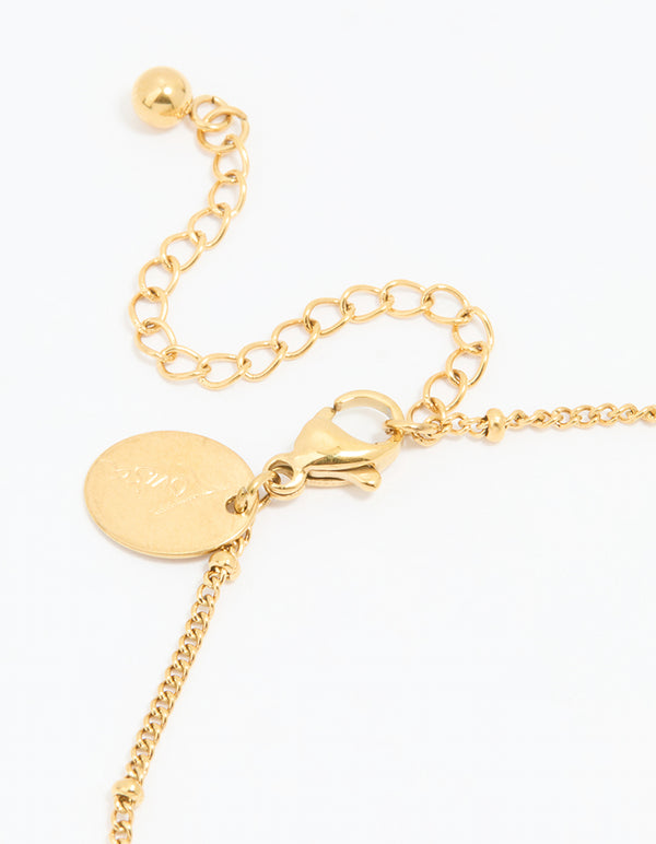 Designed with waterproof gold plated stainless steel, this dainty anklet features heart charms and ball accents in gold detail view