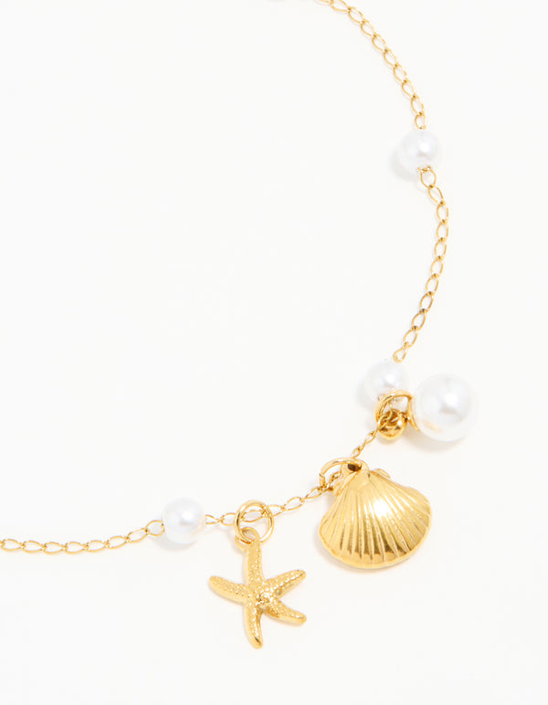 Beautifully crafted waterproof gold plated stainless steel anklet featuring charm ocean design with pearl and shell elements detail view