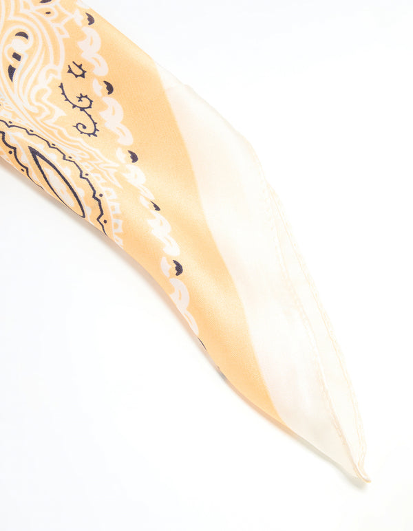 Close-up of white fabric western scarf with paisley print in ivory, khaki, black, and wheat detail view
