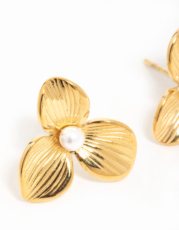 Showcasing waterproof gold plated stainless steel pearl flower stud earrings close up view