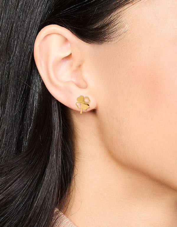 Featuring dainty heart clover stud earrings in waterproof gold plated stainless steel on ear view