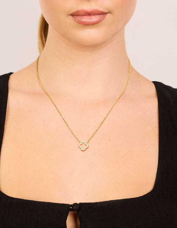 Featuring a waterproof diamante flower outline necklace with a pendant, crafted from gold plated stainless steel, in neck view
