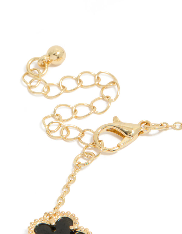 Showcasing gold plated black flowers bracelet closure detail view
