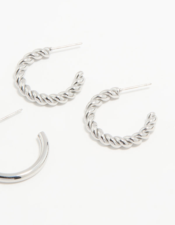Featuring waterproof stainless steel construction, twisted and smooth hoop earrings in a 3-pack with silver tone post detail view