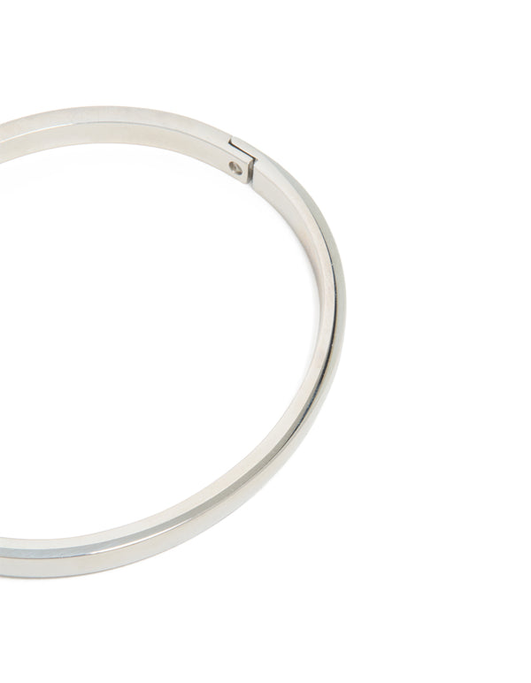 Crafted from waterproof stainless steel smooth hinge bangle in silver with statement design closure detail view