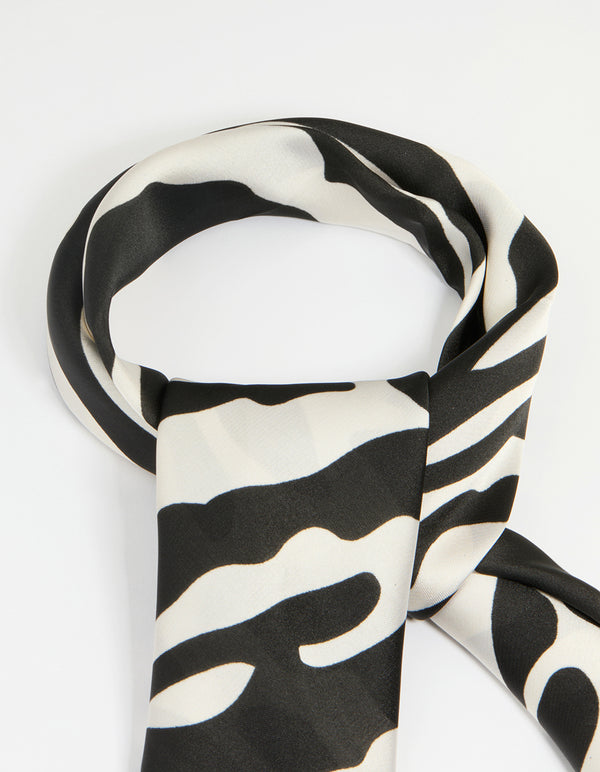 Crafted with zebra print fabric in black and white, this statement scarf side view