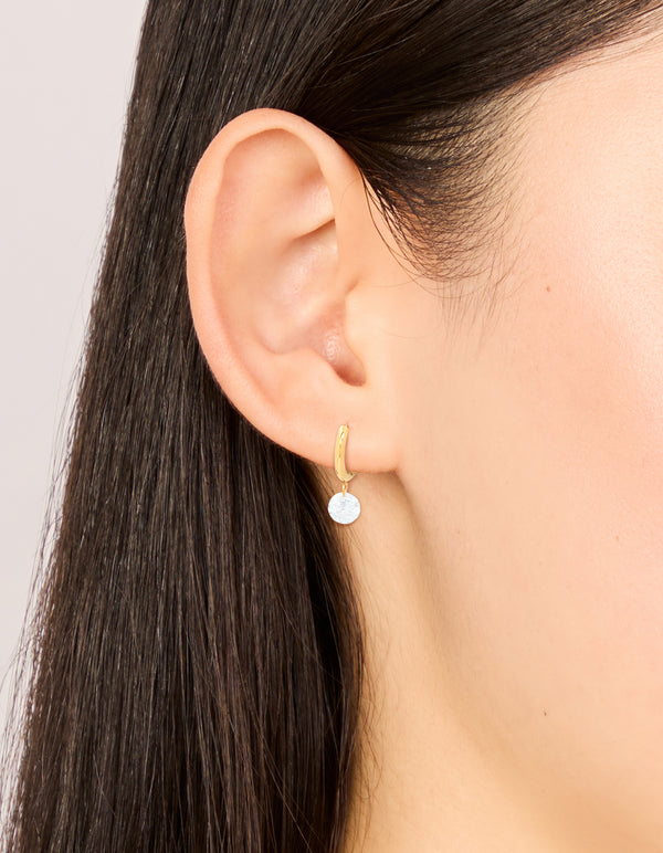 Featuring waterproof gold plated stainless steel diamante huggie earrings on ear view