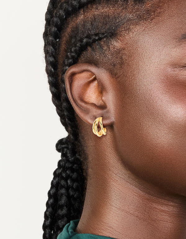 Featuring waterproof gold plated stainless steel double row hoop earrings on ear view