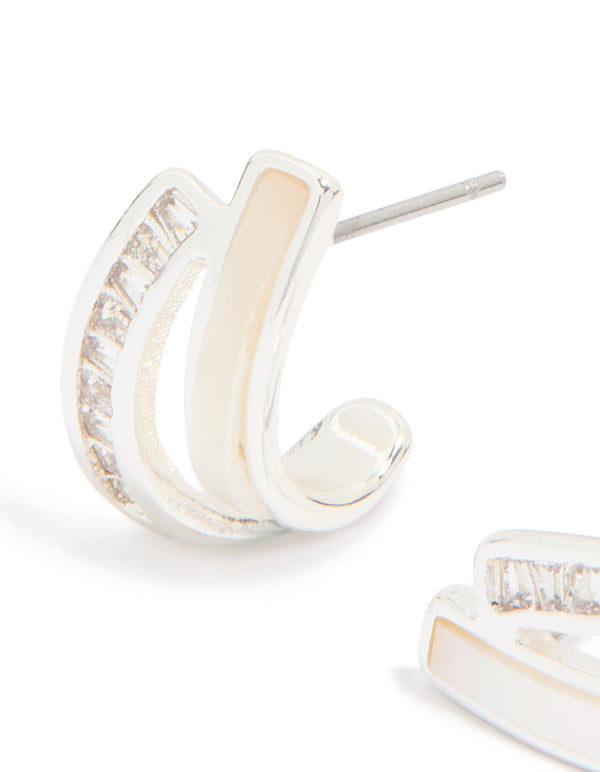 Featuring statement jacket earrings with plated material, pearl inlay, and cubic zirconia detailing in ivory tones close up view