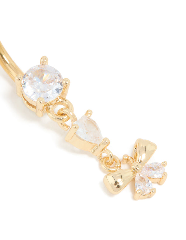 Capturing the fine bow drop belly bar with charm, designed in gold plated titanium and cubic zirconia detail view