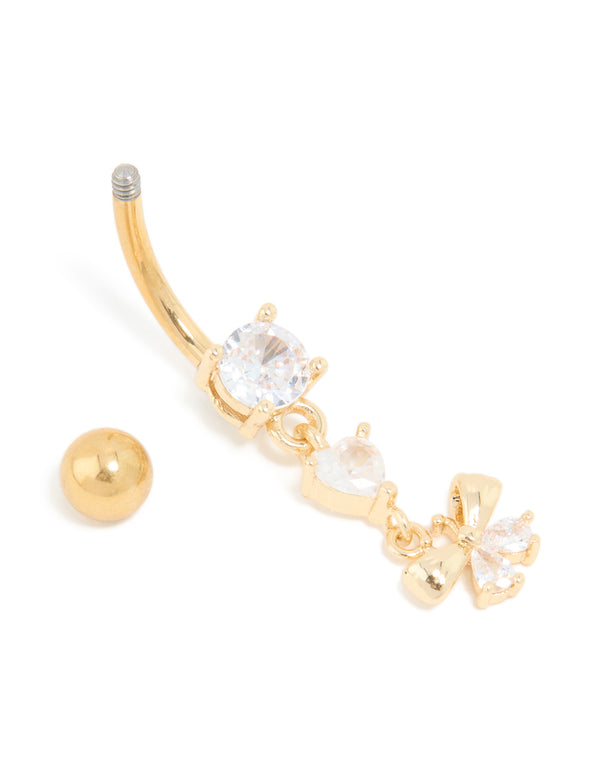 Capturing the fine bow drop belly bar with charm, designed in gold plated titanium and cubic zirconia detail view