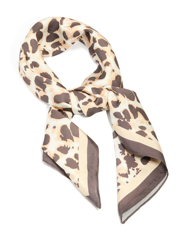 Showcasing a brown fabric scarf with animal print in tan and rosy brown front view