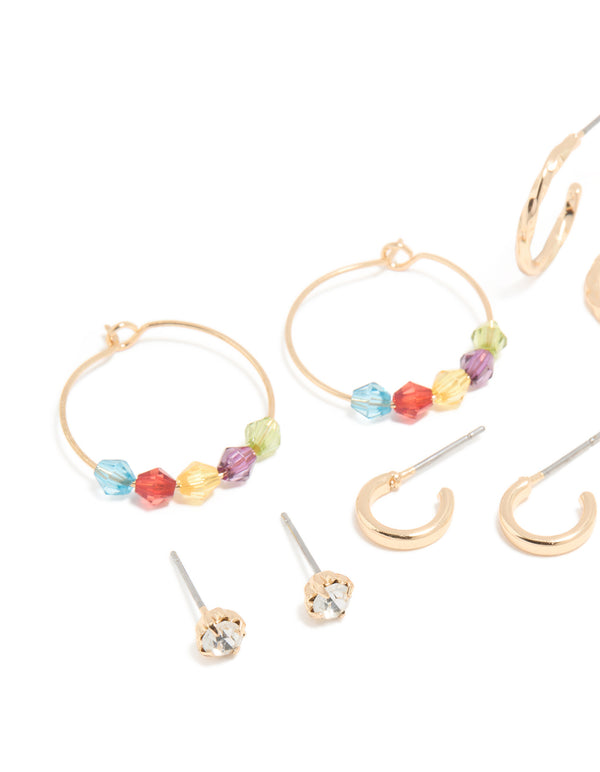 Stunning gold multicoloured diamante stud and hoop earrings 7-pack with bar and beads elements in pink, aqua, and yellow close up view