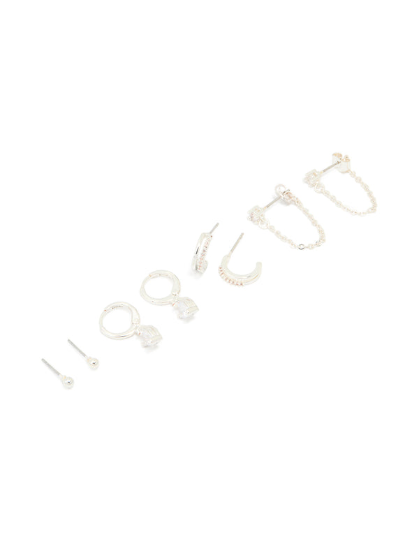 Discover dainty charm heart huggie and stud earrings crafted from silver plated brass with cubic zirconia in a 4-pack front view