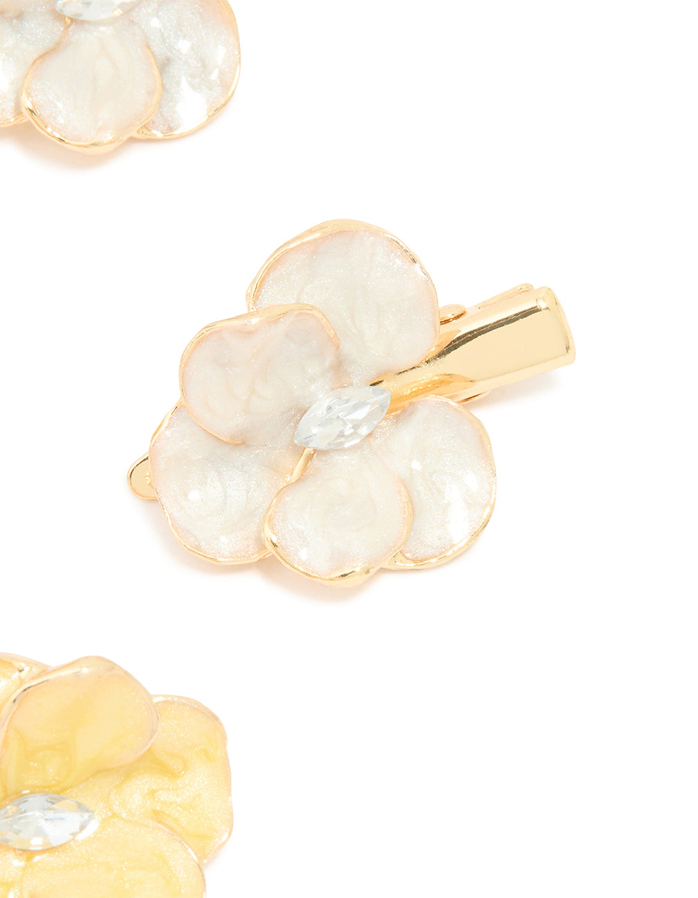 Designed with enamel material, orchid flower hair clips in a 4-pack showcase in gold tones side view