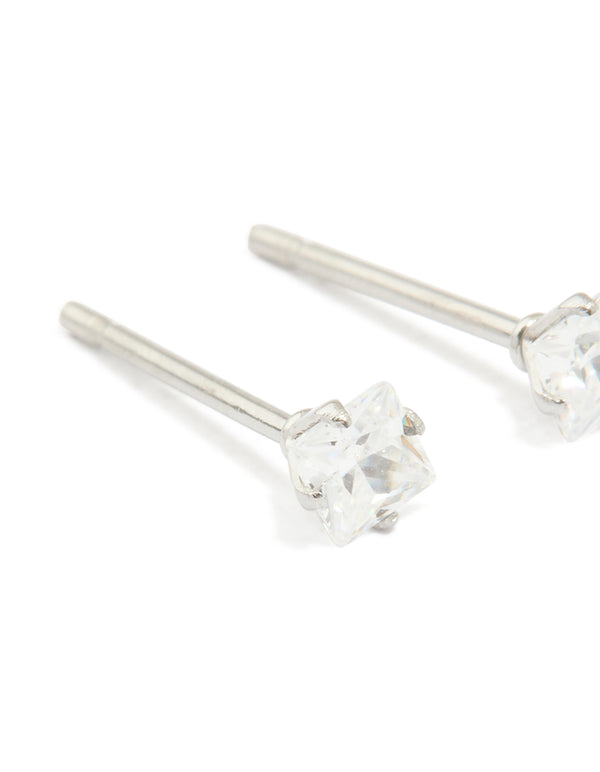 Designed with waterproof stainless steel prism cubic zirconia stud earrings in silver and clear close up view